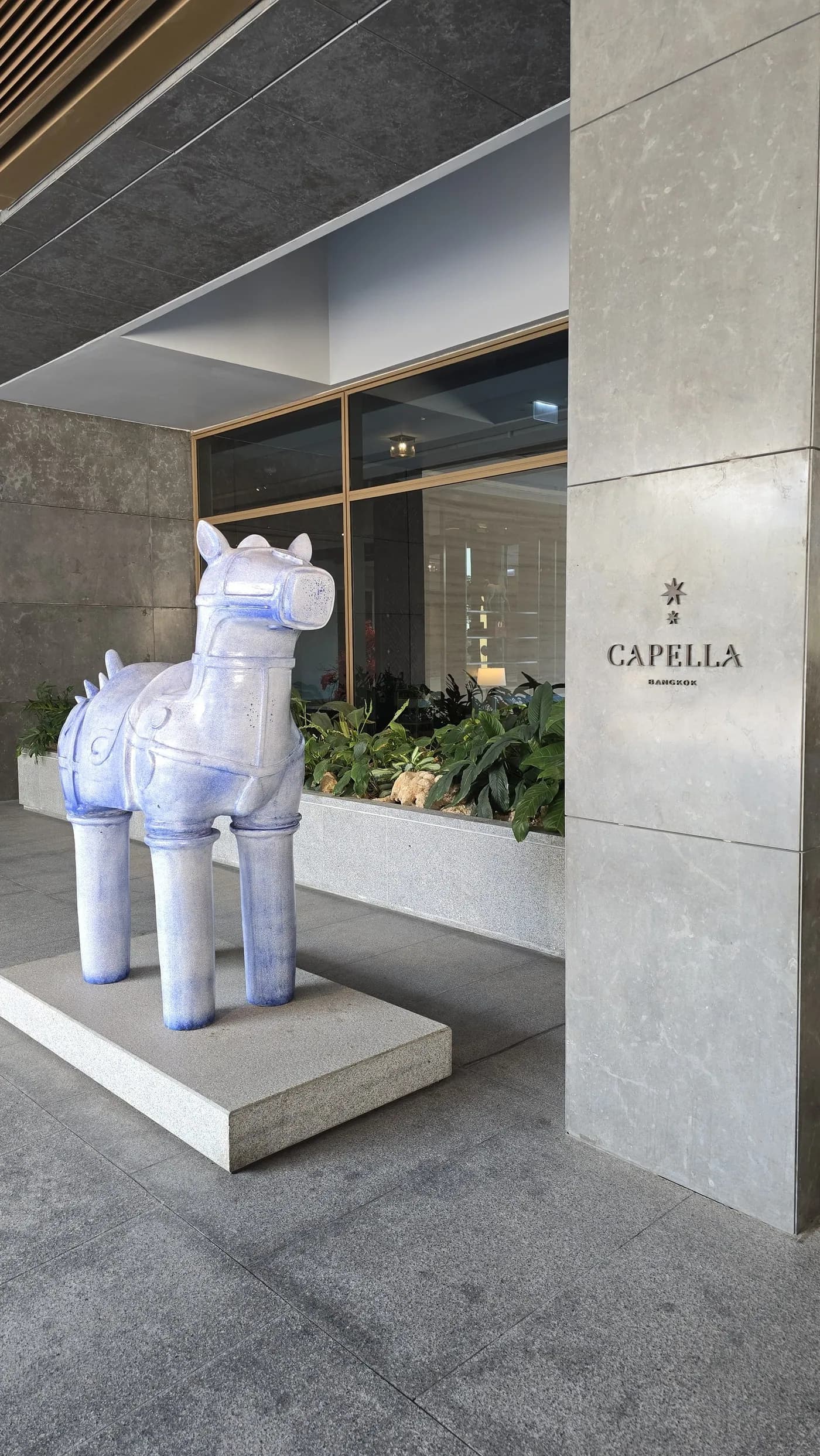 Capella Bangkok entrance sign and sculptural arrival detail